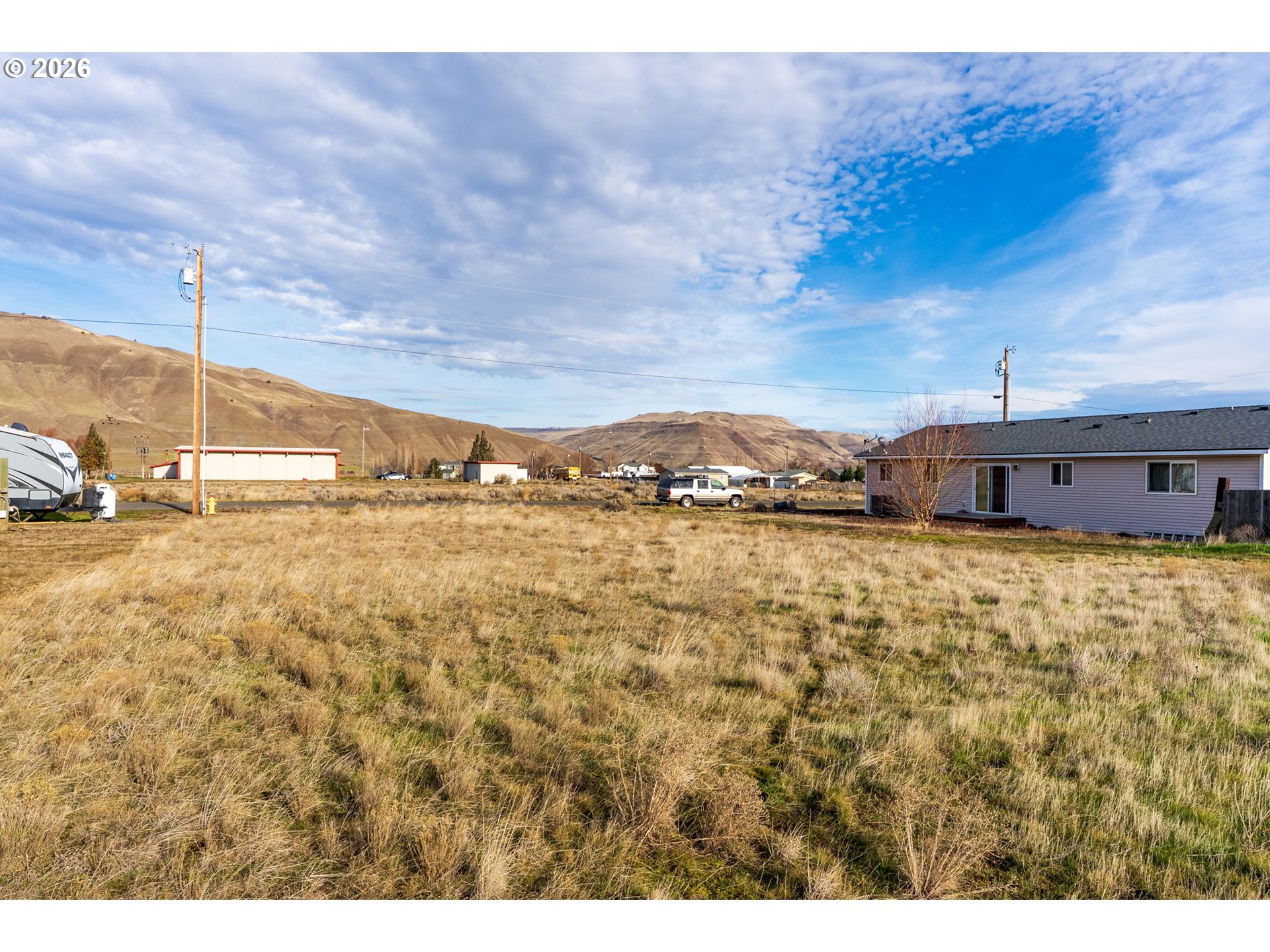 Poplar Street, Unit 33 Roosevelt, WA 99356 - Photo 10 of 12 a view of a houses with sky view