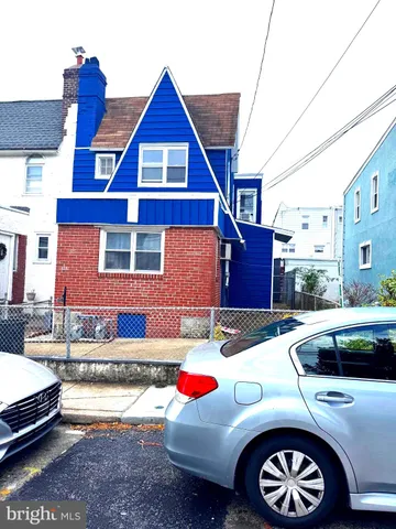 a front view of a house with parking space