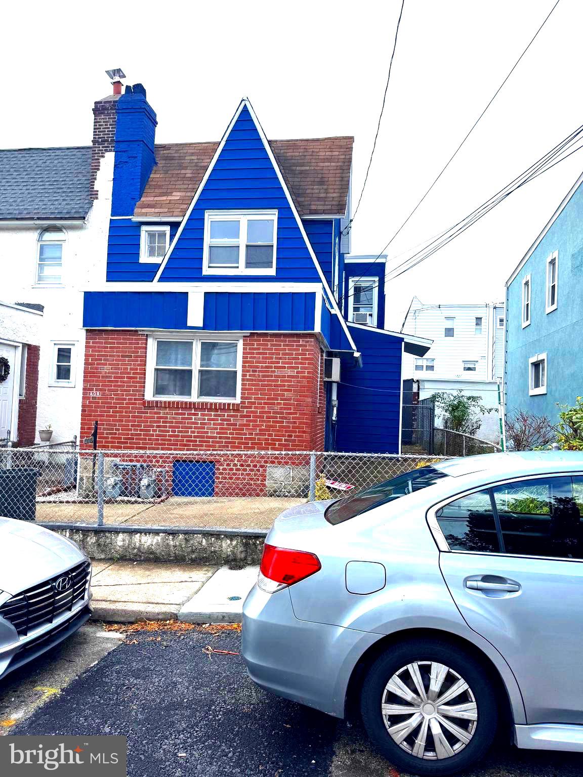 a front view of a house with parking space