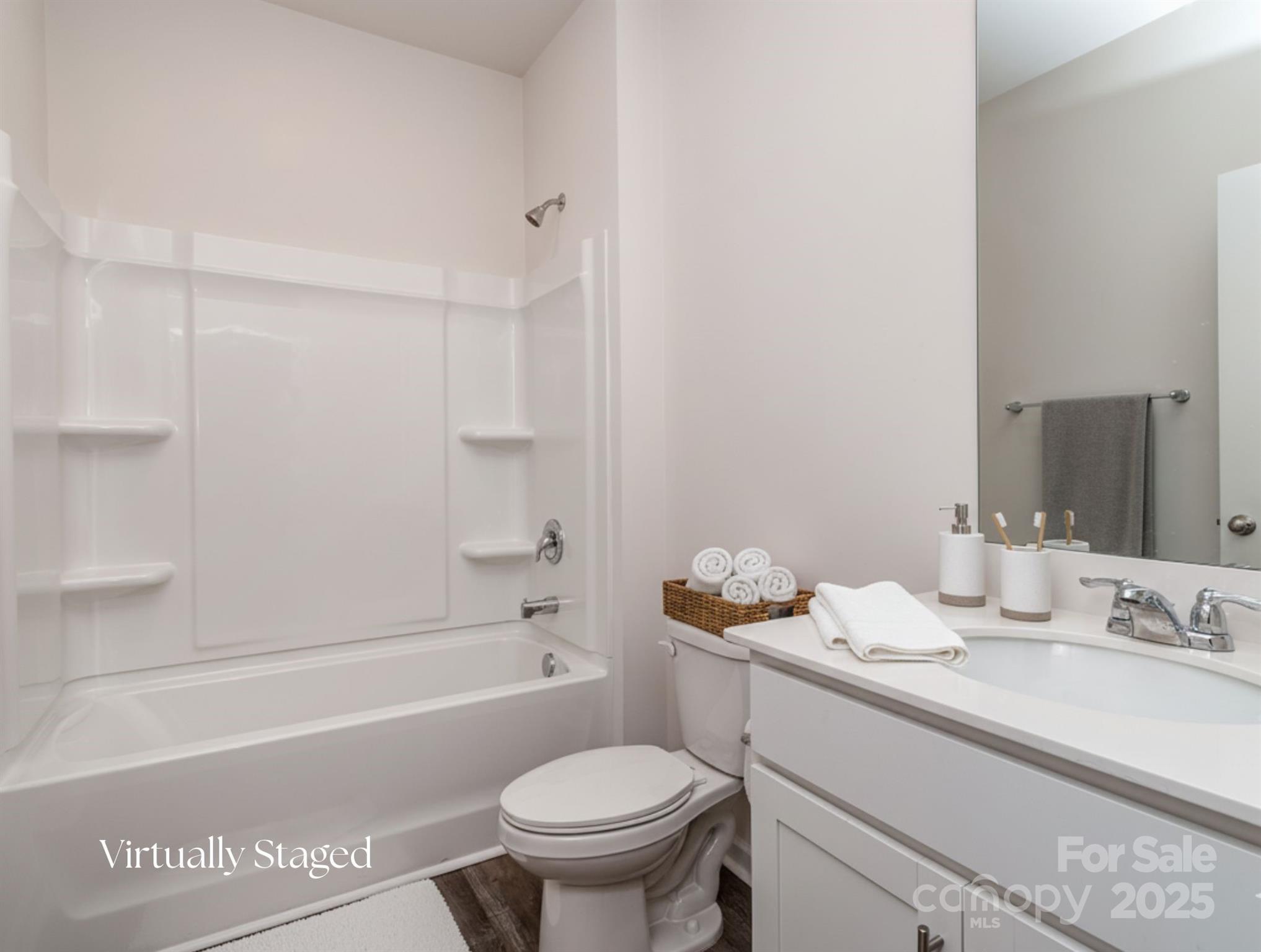 1843 Vanderlyn Street Monroe, NC 28112 - Photo 11 of 28 a bathroom with a granite countertop sink toilet and shower