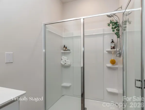 a bathroom with a shower and toilet