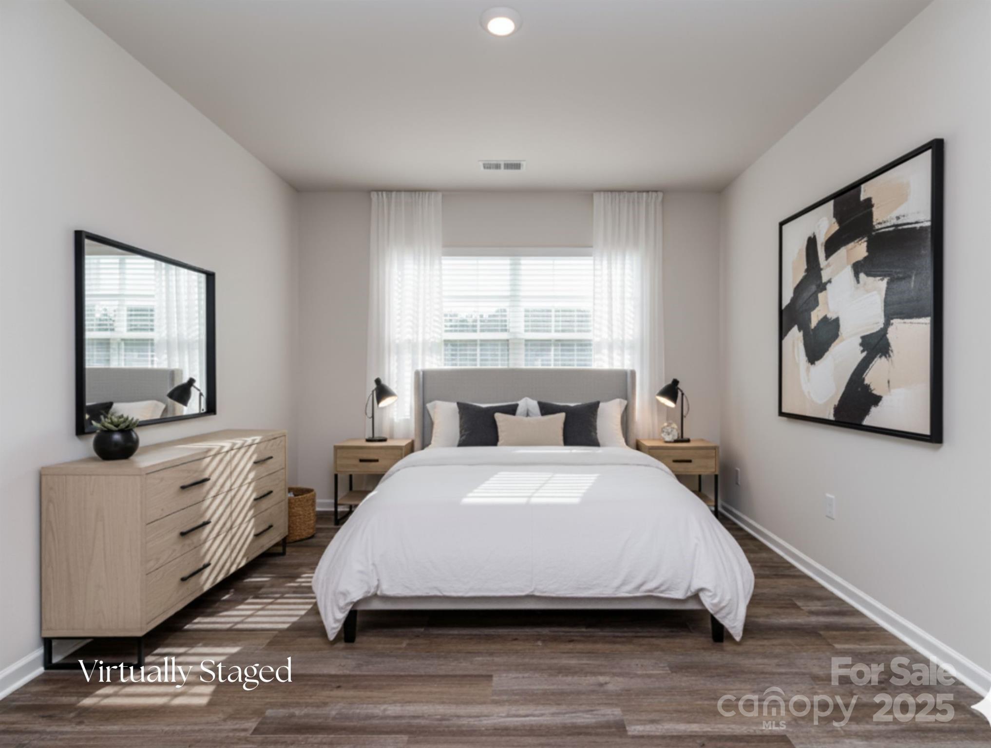 1843 Vanderlyn Street Monroe, NC 28112 - Photo 15 of 28 a spacious bedroom with a bed and window