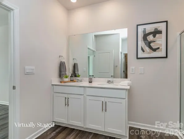 a bathroom with 2 sink and a mirror