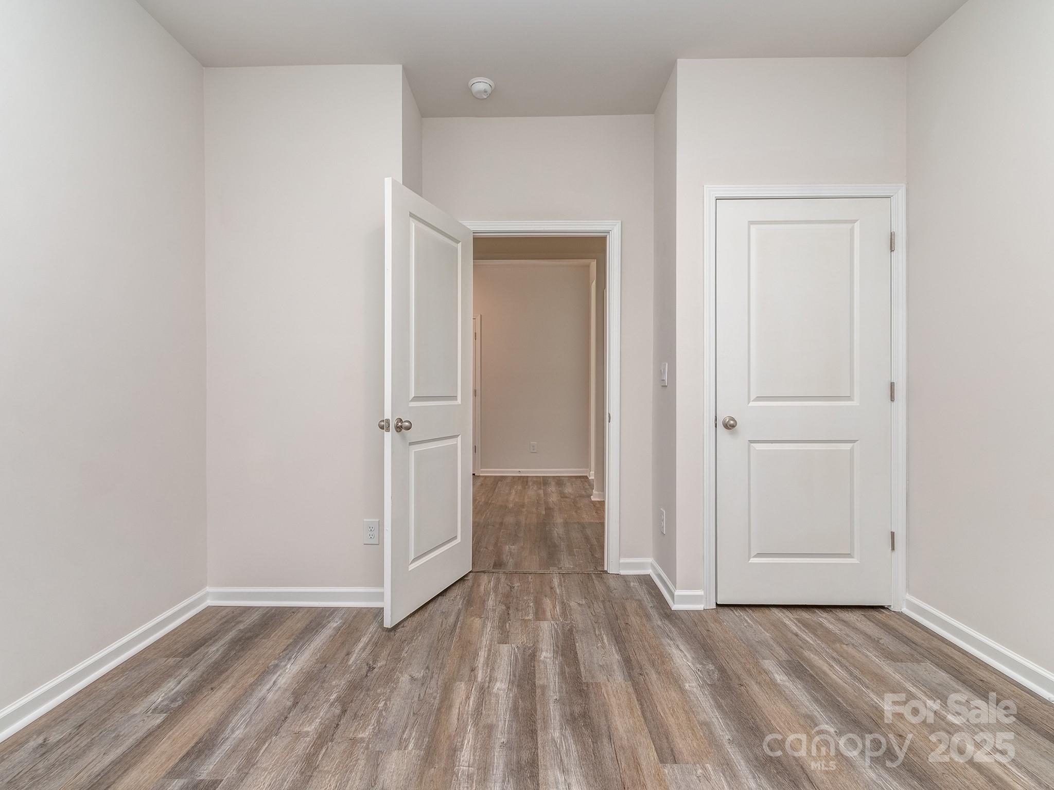 1843 Vanderlyn Street Monroe, NC 28112 - Photo 20 of 28 a view of an empty room with wooden floor and closet