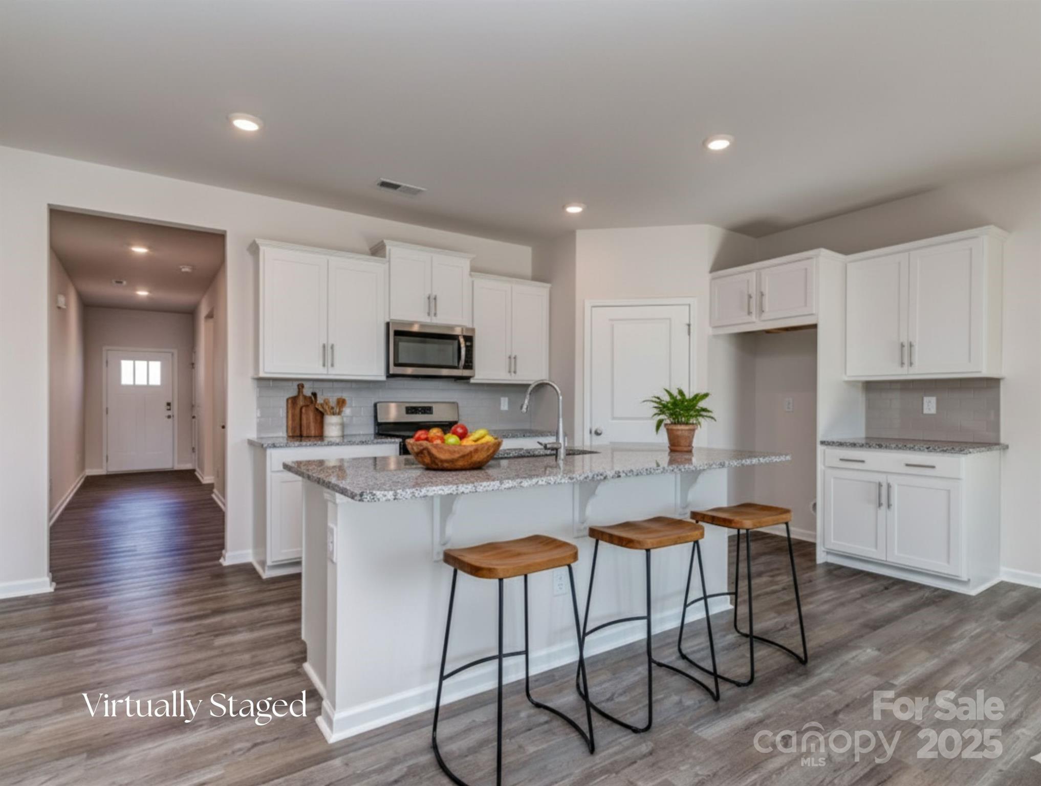 1843 Vanderlyn Street Monroe, NC 28112 - Photo 5 of 28 a kitchen with granite countertop white cabinets and stainless steel appliances