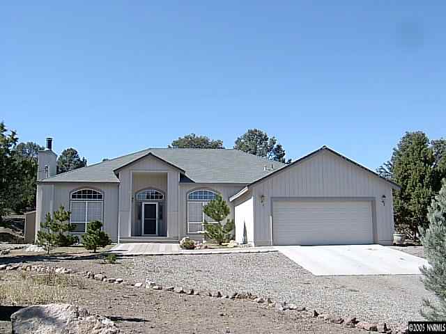 2420 Grizzley Road Reno, NV 89521 - Photo 1 of 9 a view of a house with a yard and plants
