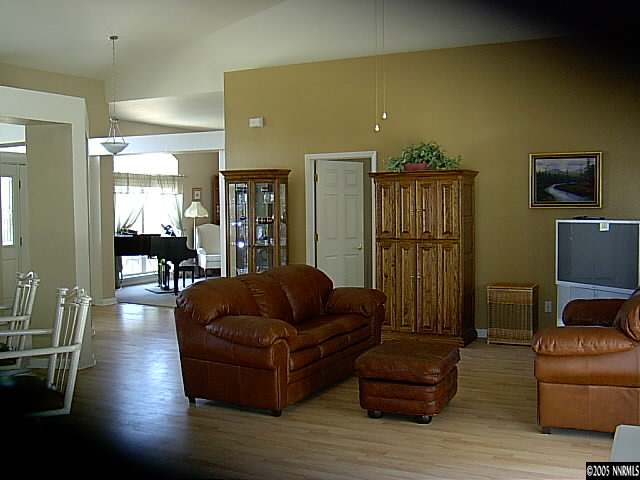 2420 Grizzley Road Reno, NV 89521 - Photo 3 of 9 a living room with furniture and wooden floor