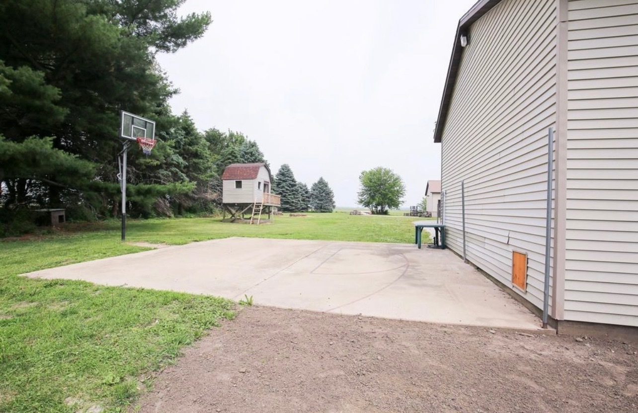 382 Keigwin Road Walnut, IL 61376 - Photo 15 of 49 a view of a house with a yard and a garage