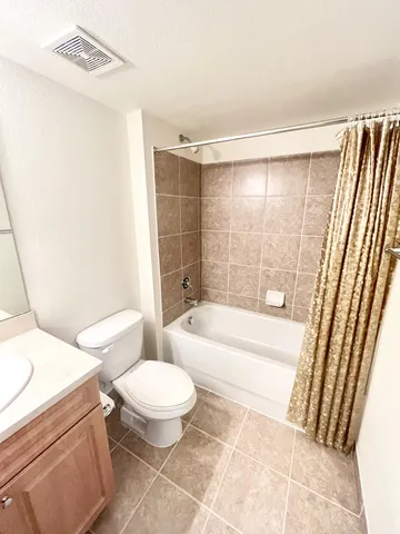 a bathroom with a toilet a sink and a bathtub