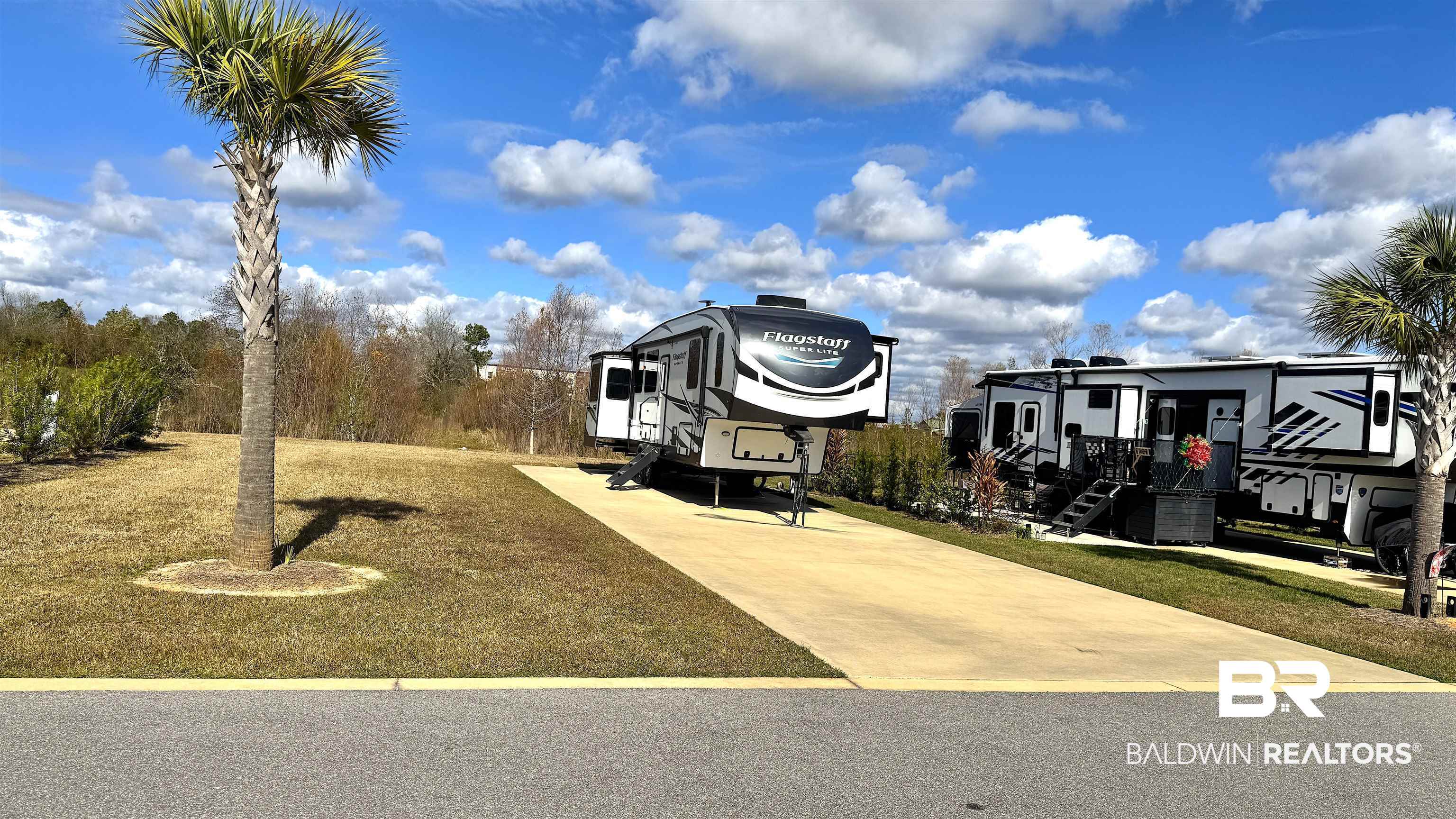 717 Vacation Circle Foley, AL 36535 - Photo 2 of 9 View of home's community featuring a lawn