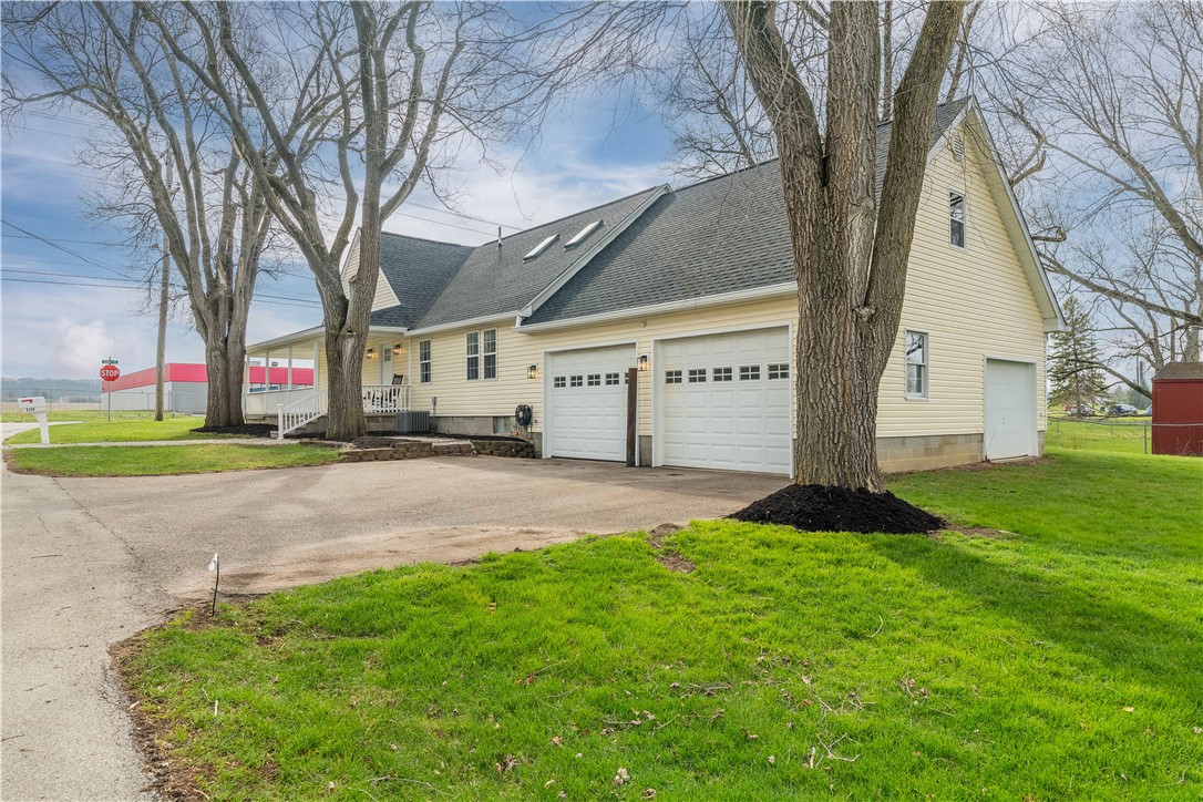 8240 Looney Road Piqua, OH 45356 - Photo 48 of 49 This inviting residence offers generous curb appeal and practical garage space.