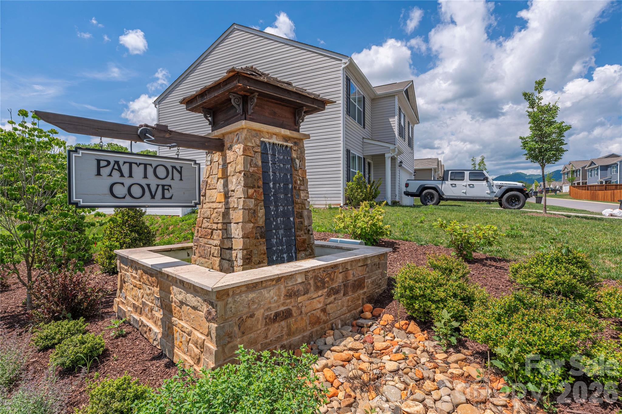 8 Madelyn Drive Clyde, NC 28721 - Photo 2 of 43 a view of a street with potted plants