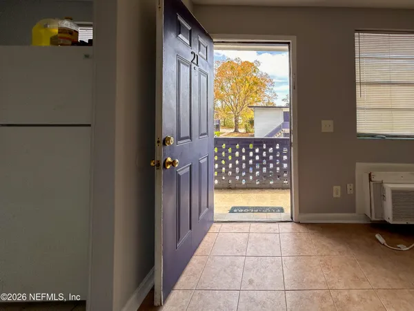 a view of entryway with wooden floor