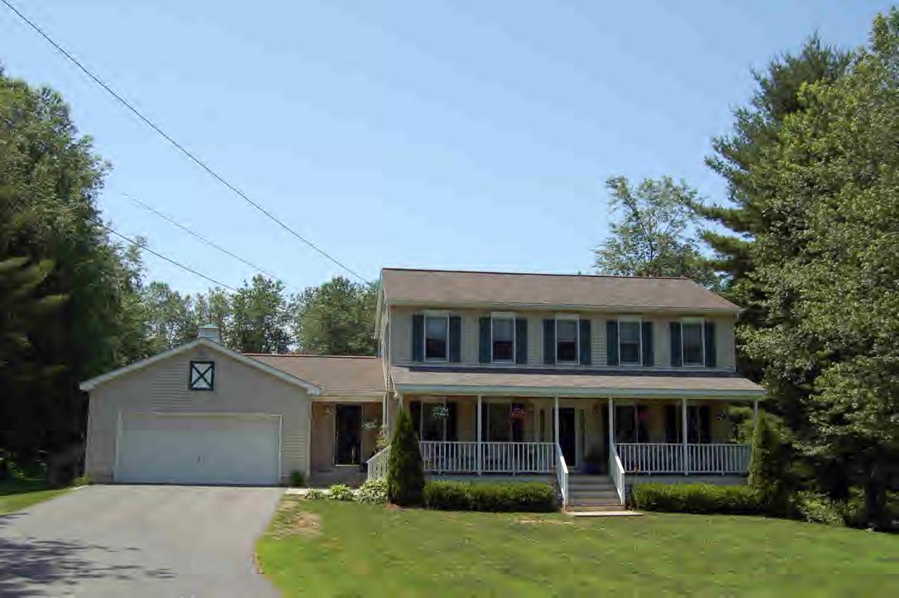 114 Salisbury Road Sheffield, MA 01257 - Photo 1 of 8 a front view of a house with a garden and trees