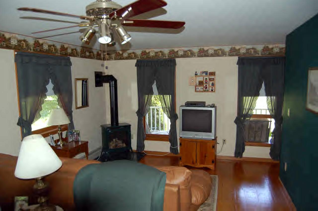 114 Salisbury Road Sheffield, MA 01257 - Photo 7 of 8 a living room with furniture and a flat screen tv