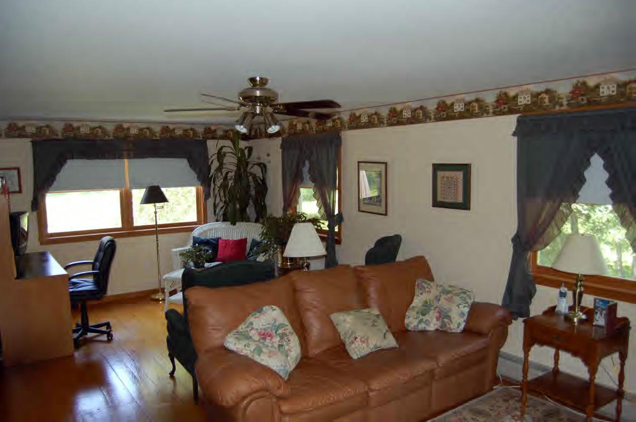 114 Salisbury Road Sheffield, MA 01257 - Photo 8 of 8 a living room with furniture and a chandelier