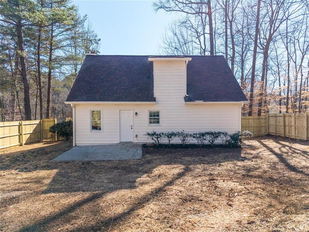 540 Riverside Road Sugar Hill, GA 30518 - Photo 20 of 25 a view of a house with a yard