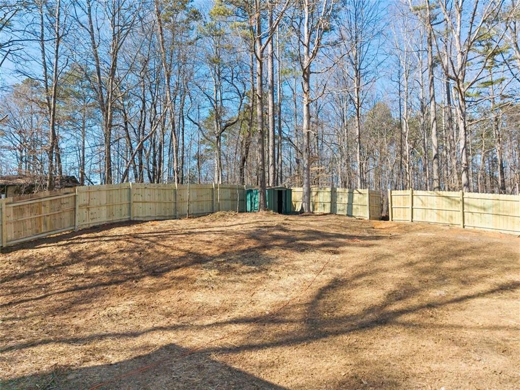 540 Riverside Road Sugar Hill, GA 30518 - Photo 21 of 25 a view of empty space with large trees