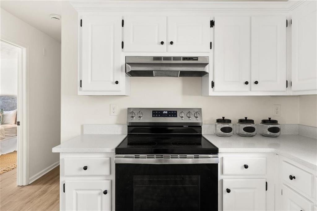 540 Riverside Road Sugar Hill, GA 30518 - Photo 8 of 25 a white stove top oven sitting inside of a kitchen