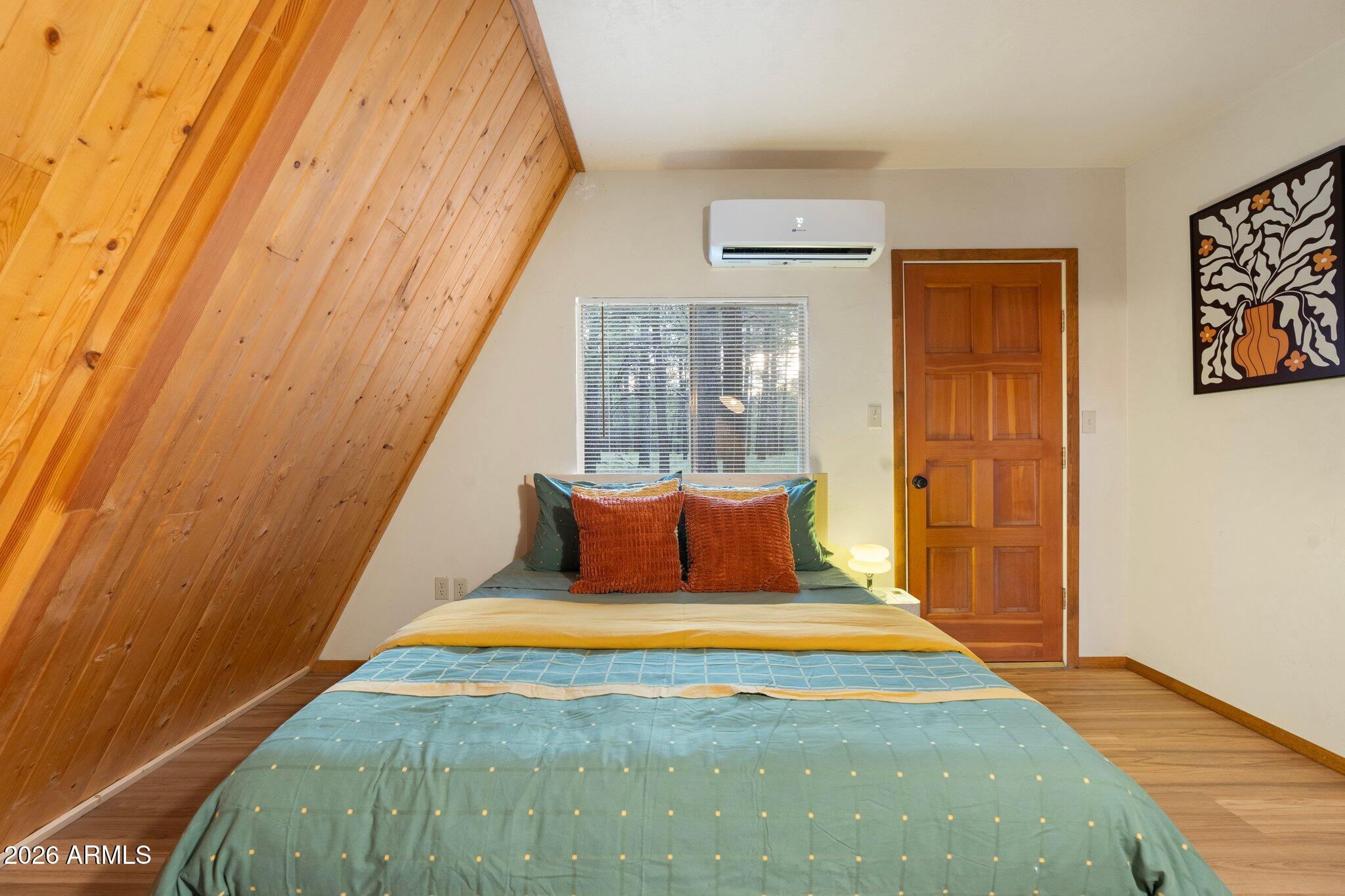 10434 Little Red Road Parks, AZ 86018 - Photo 15 of 35 a bedroom with a bed and a window
