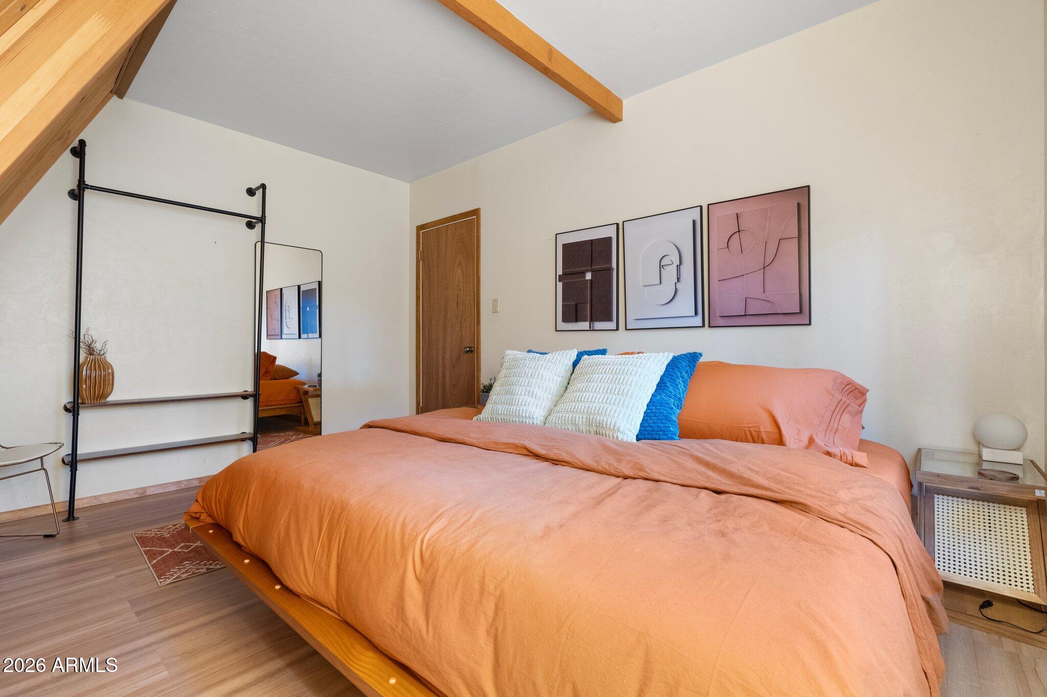 10434 Little Red Road Parks, AZ 86018 - Photo 23 of 35 a bed sitting in a bedroom next to a window