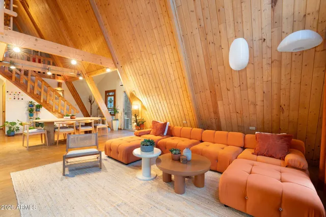 a view of a lush green forest with a house