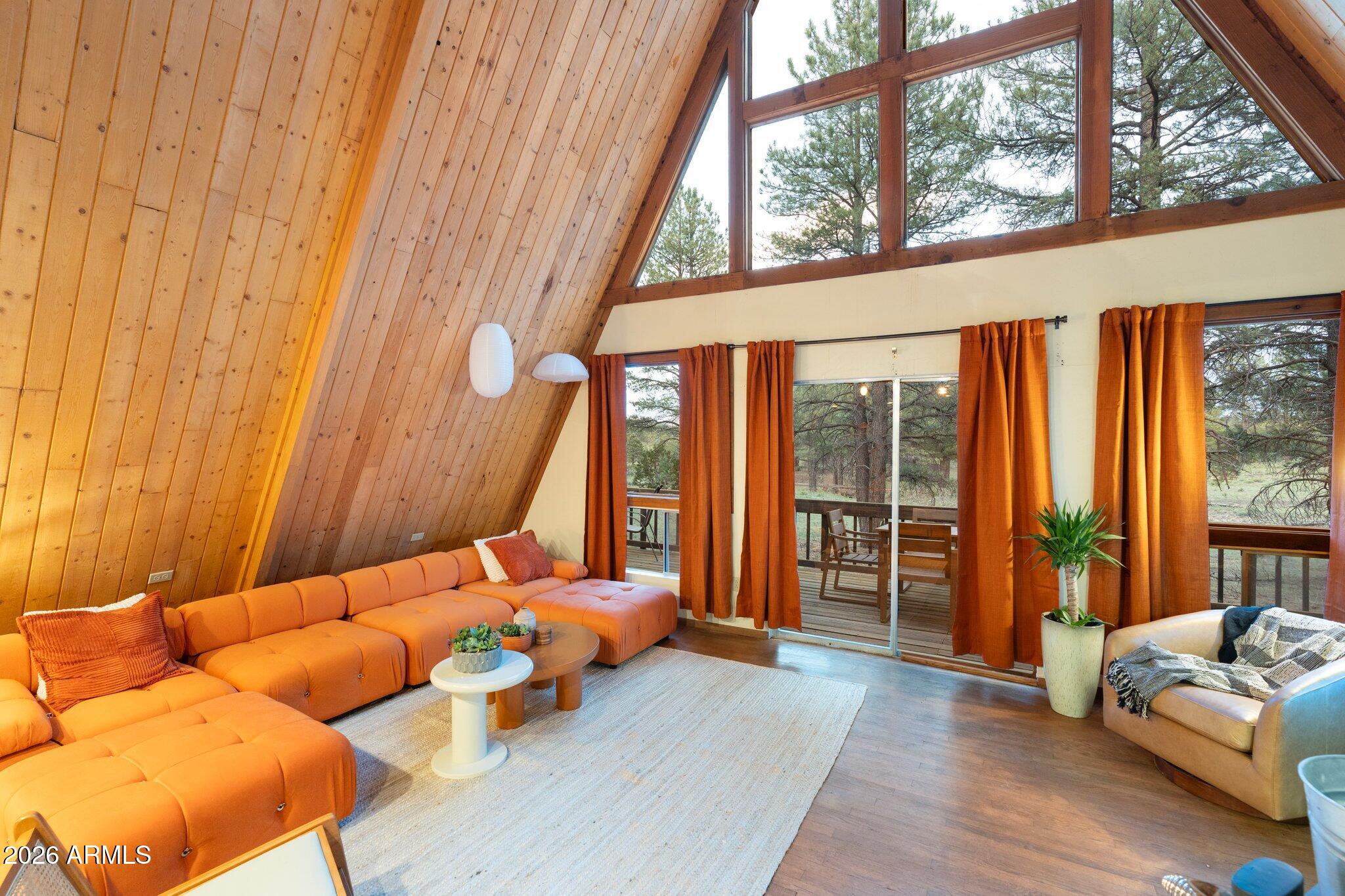 10434 Little Red Road Parks, AZ 86018 - Photo 28 of 35 a bedroom with furniture and large windows