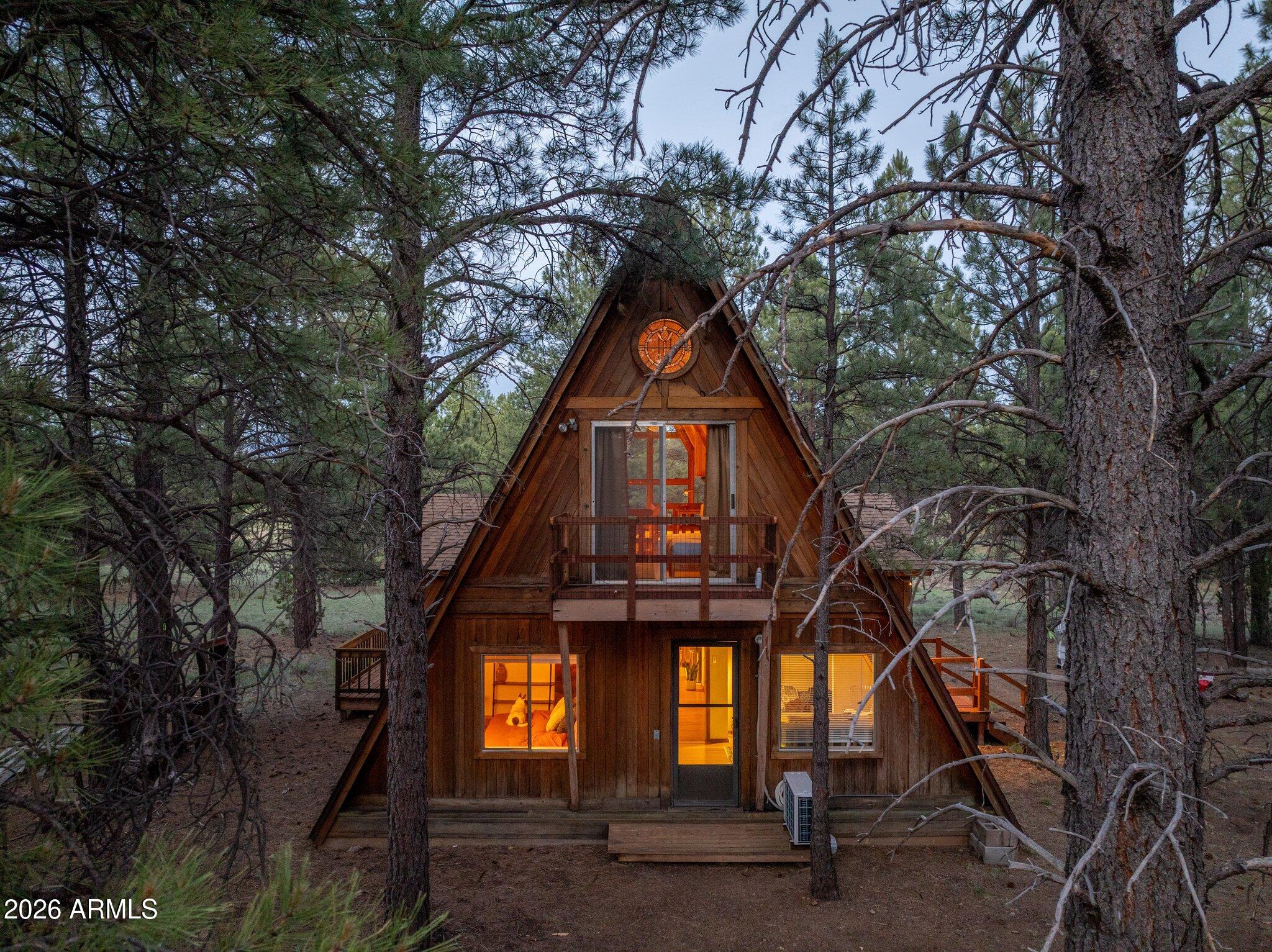 10434 Little Red Road Parks, AZ 86018 - Photo 29 of 35 a front view of a house with a tree