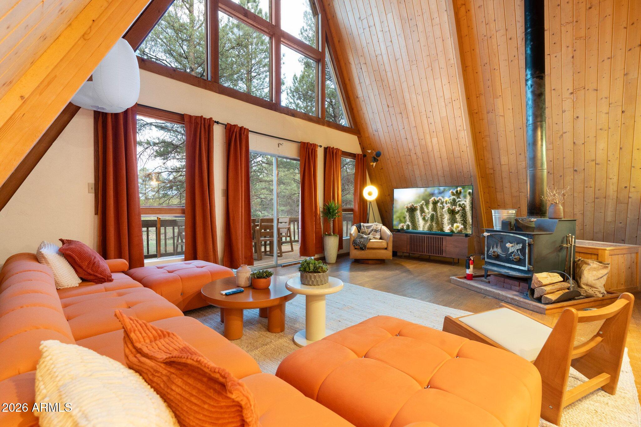 10434 Little Red Road Parks, AZ 86018 - Photo 6 of 35 a living room with furniture a large window and a rug