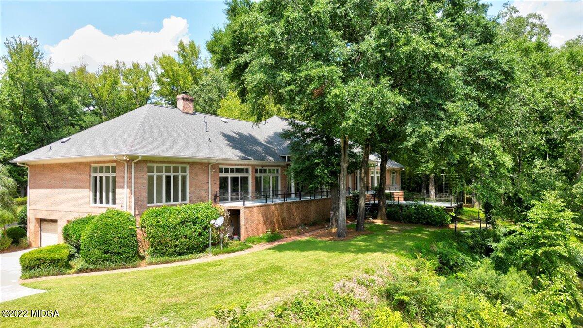1 River Trace Macon, GA 31210 - Photo 12 of 62 a view of an house with backyard space and garden