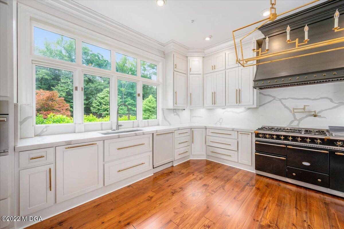 1 River Trace Macon, GA 31210 - Photo 26 of 62 a kitchen with stainless steel appliances a stove sink and cabinets