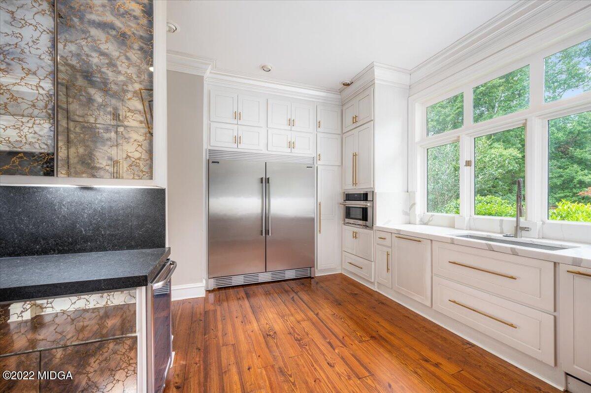 1 River Trace Macon, GA 31210 - Photo 28 of 62 a kitchen with stainless steel appliances granite countertop a refrigerator and a sink