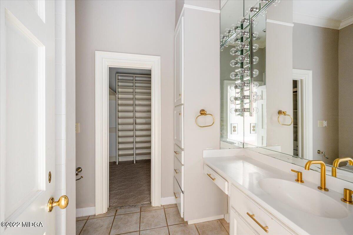1 River Trace Macon, GA 31210 - Photo 39 of 62 a bathroom with a granite countertop sink and a mirror