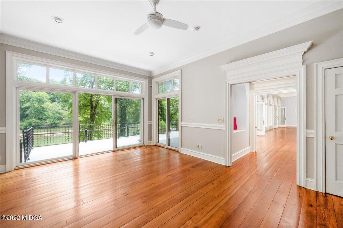 1 River Trace Macon, GA 31210 - Photo 47 of 62 a view of an empty room with wooden floor and a window