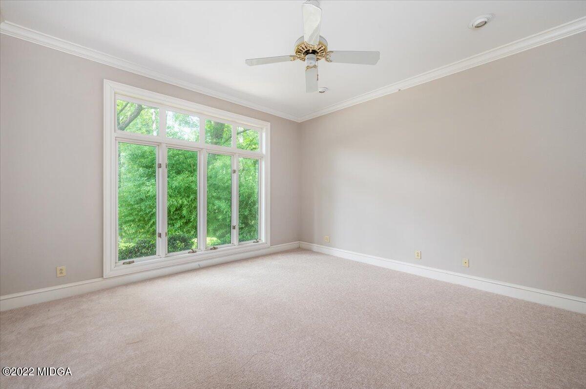 1 River Trace Macon, GA 31210 - Photo 51 of 62 a view of a big room with windows and chandelier fan