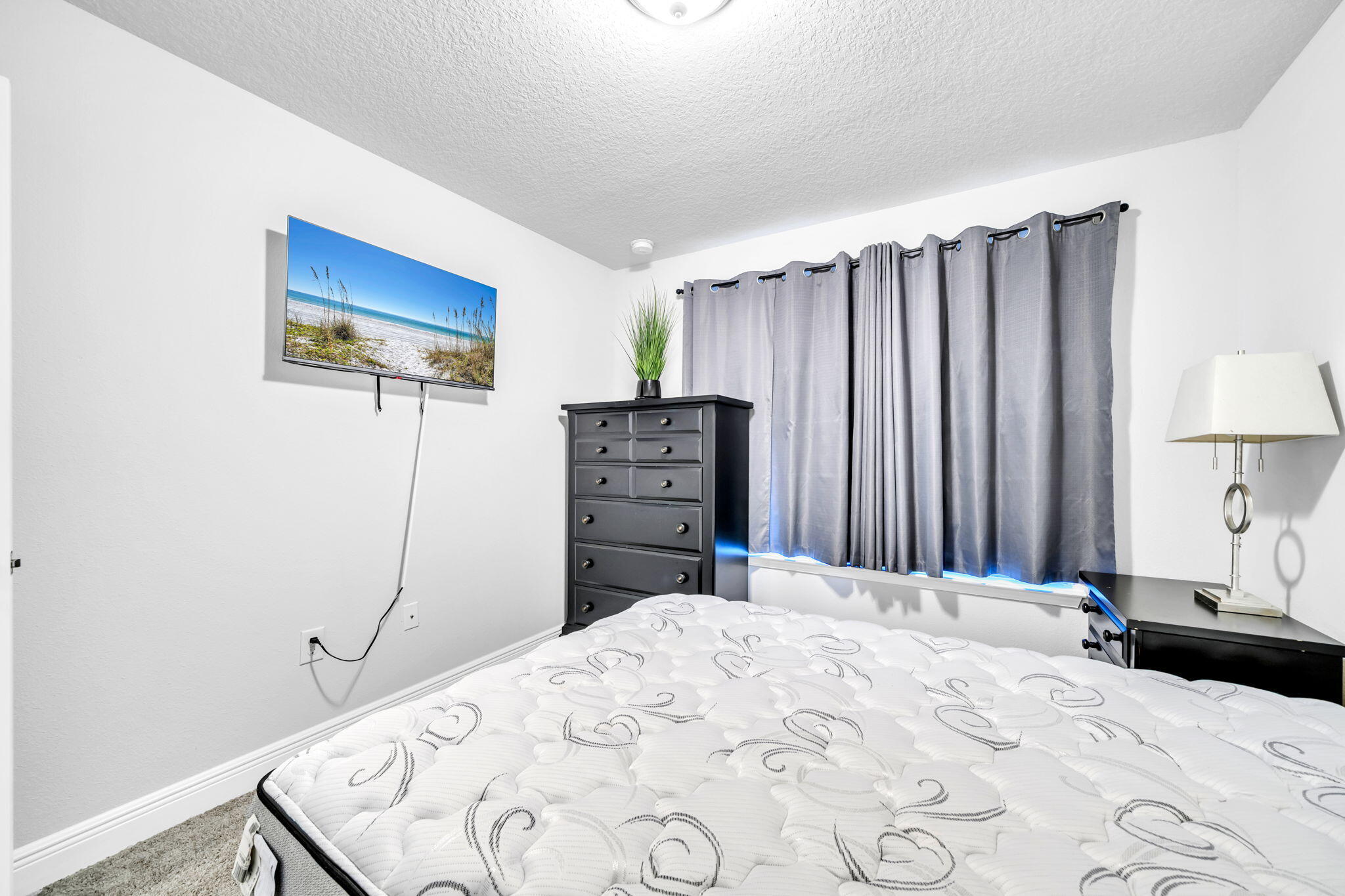 125 Ridgeway Circle Crestview, FL 32536 - Photo 11 of 41 a bedroom with a bed and a dresser