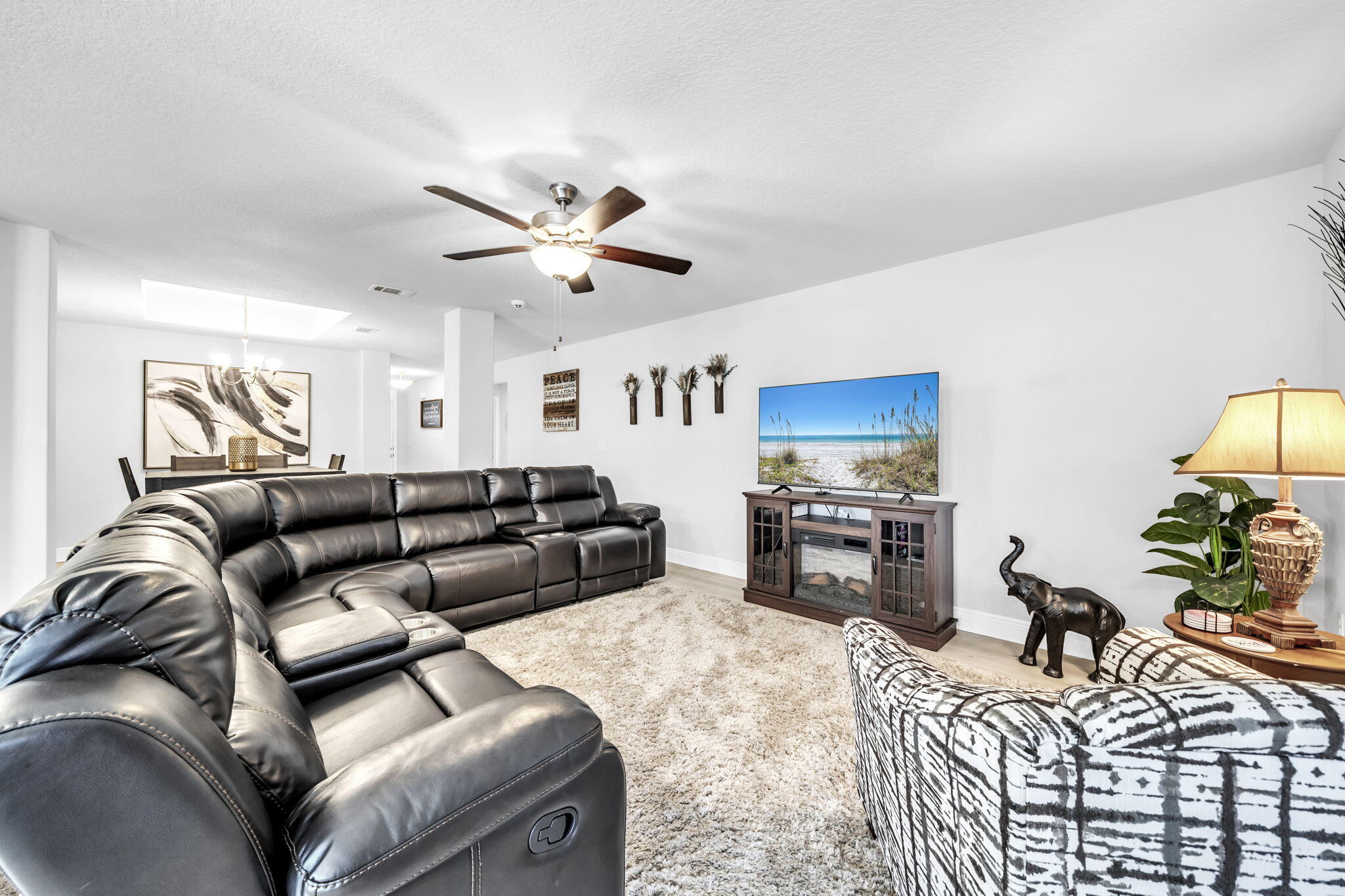 125 Ridgeway Circle Crestview, FL 32536 - Photo 22 of 41 a living room with furniture ceiling fan and a flat screen tv