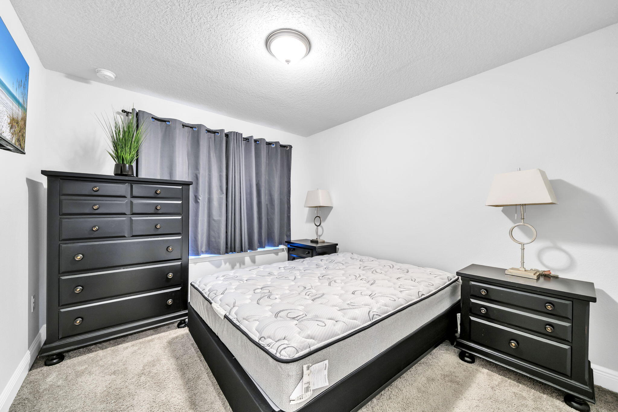 125 Ridgeway Circle Crestview, FL 32536 - Photo 10 of 41 a bedroom with a bed and a dresser