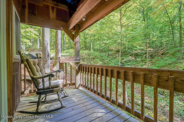 a view of a forest with a house and forest