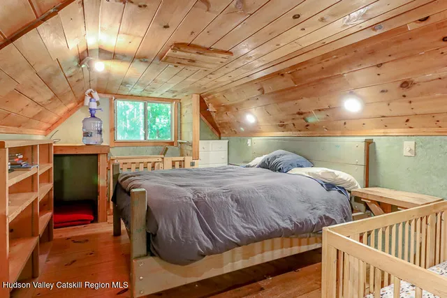 a view of a house with large trees