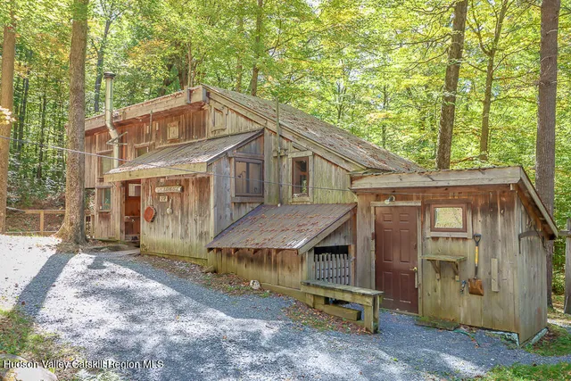 a view of a house with a yard and balcony