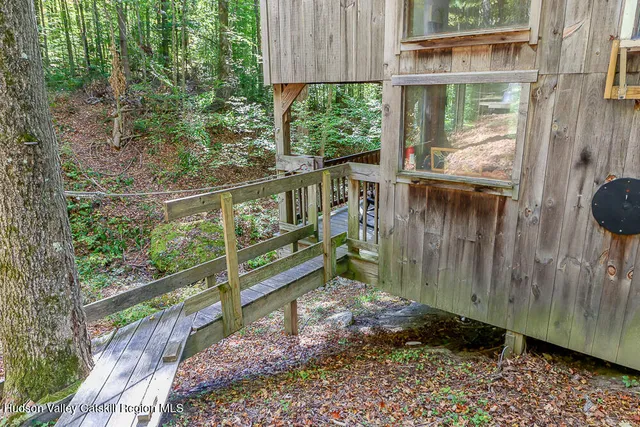 a view of a balcony with wooden floor