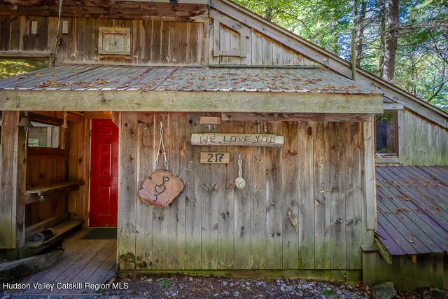 a view of a wooden house with a outdoor space