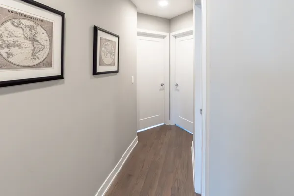 a view of room with wooden floor