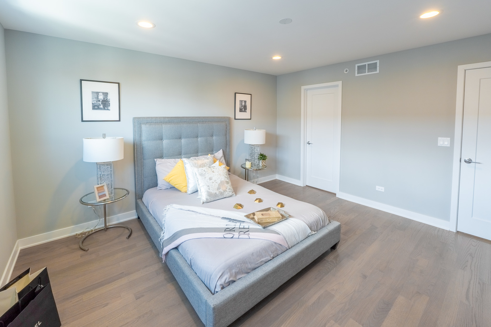 2631 South Throop Street, Unit E Chicago, IL 60608 - Photo 14 of 25 a bed room with a bed and a night stand