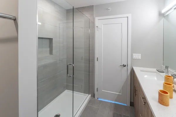 a bathroom with a tub and shower