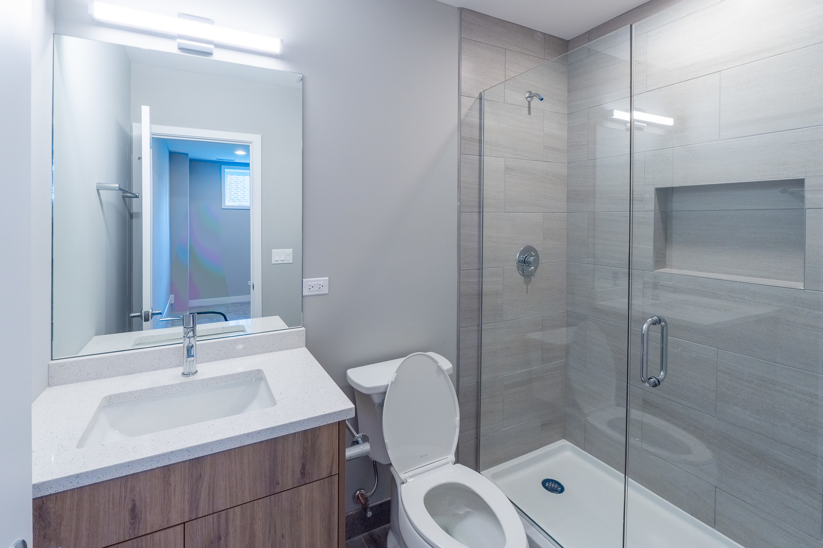2631 South Throop Street, Unit E Chicago, IL 60608 - Photo 19 of 25 a bathroom with a sink toilet and shower