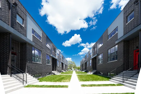 a view of a building with a yard