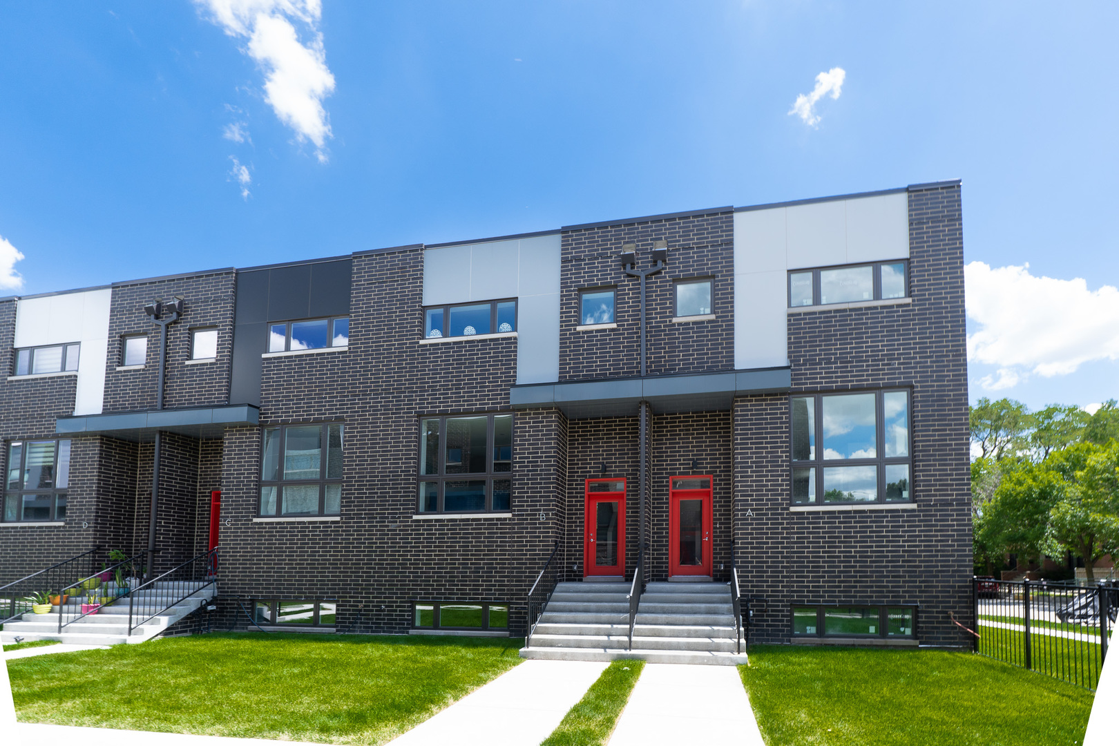 2631 South Throop Street, Unit E Chicago, IL 60608 - Photo 3 of 25 a front view of a house with yard and green space