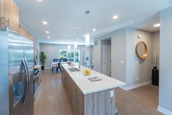 a kitchen and a refrigerator in a kitchen